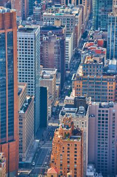 Image of Above New York City looking down street lined with skyscrapers