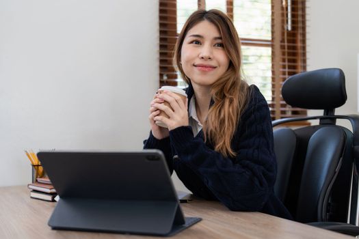 Asian woman working with laptop at home. work from home concept.