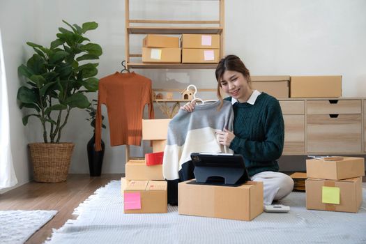 Online seller owner. Online shopping. Business Start up SME concept. Young startup entrepreneur small business owner working at home