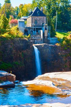 Image of Hydroelectric power plant with waterfall over cliffs in New York