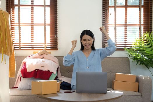 Startup small business entrepreneur SME, asian woman packing box. Portrait of young Asian small business owner in home office, online sell marketing delivery