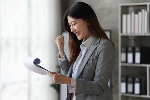 Smart asian business woman smiling at office space. real estate, lawyer, non-profit, marketing concept.