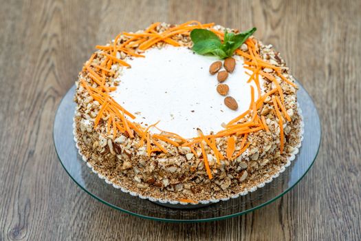 carrot cake with nuts and cream.