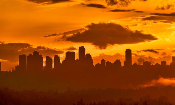 Silhouette of Metrotown in Vancouver on sunset sky background. Urban cityscape on sunset sky background