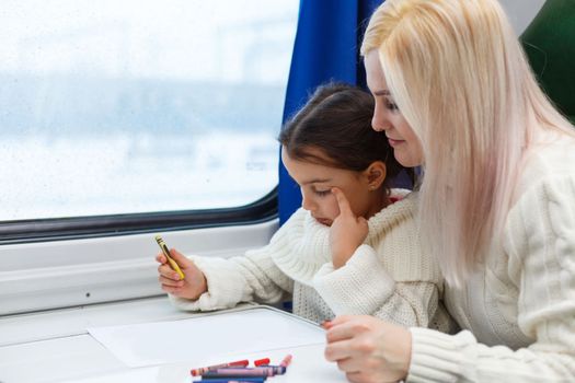 daughter and mother in the train.