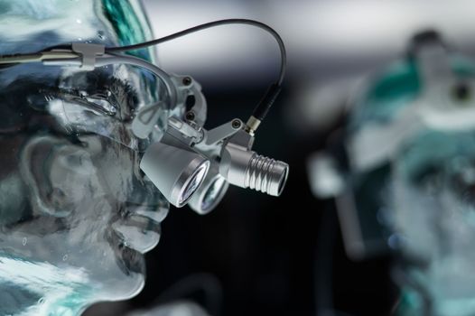 Dentist's microscope on a transparent mannequin at a medical exhibition