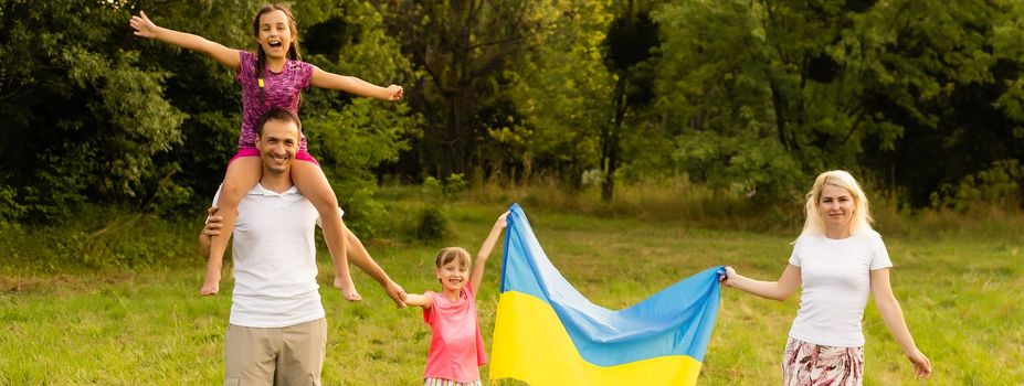 Ukraine's Independence Flag Day. Constitution day. family with the flag of ukraine in field. 24 August. Patriotic holiday