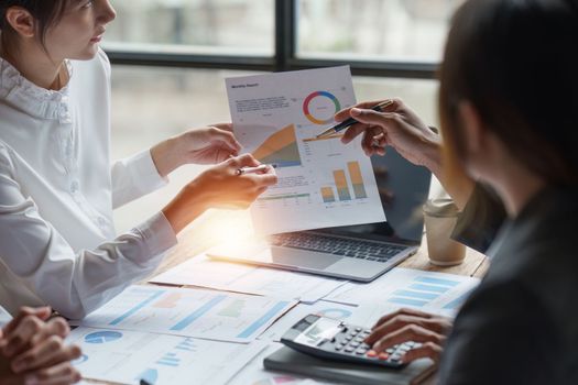 Group of Business people meeting for analysis data figures to plan business strategies. Business discussing, finance concept.