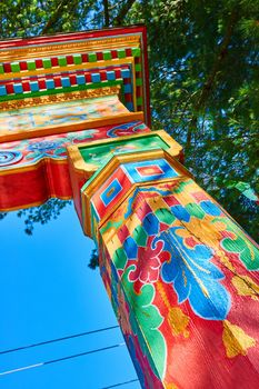 Image of Colorful main gate post details at Tibetan Mongolian Buddhist Cultural Center