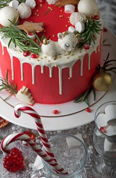 Homemade Christmas cake on rustic wooden stand and holiday decoration