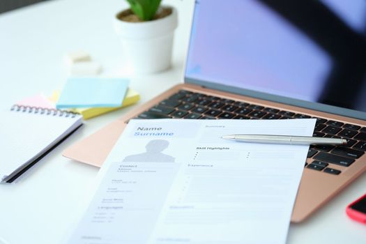 Blank resume form on computer on table. Rules for filling out resume concept