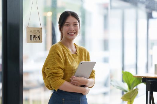 Portrait of Startup successful small business owner in coffee shop. SME entrepreneur seller business concept.