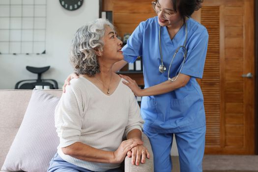 Asian youthful nurse caring for patients or the elderly at home. nursing at home concept.