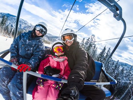 Skiing, ski lift, winter - skiers on ski lift.