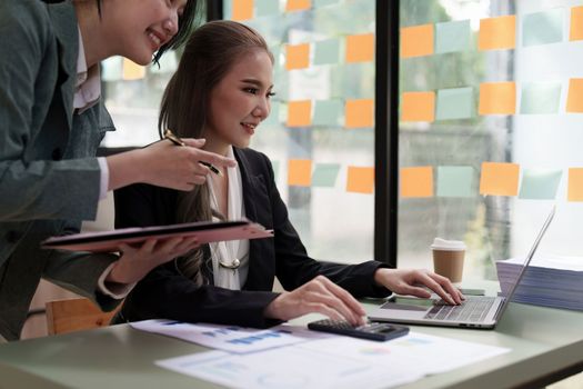 Group of business consultant working management big data and analyze financial document of company.