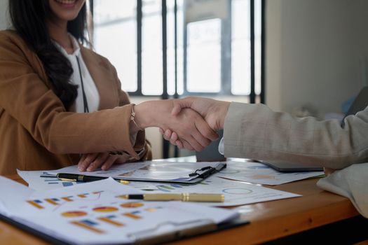 Business partnership meeting concept. Image businessmans handshake. Successful businessmen handshaking after good deal. Group support concept..