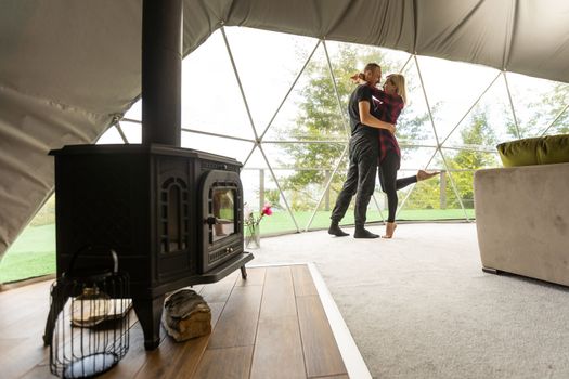 a couple dancing in geo dome tents