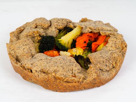 vegetarian salty pie wholewheat organic flour on white background studio shot