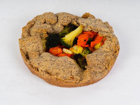 vegetarian salty pie wholewheat organic flour on white background studio shot