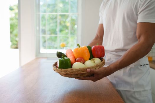 Portrait of beautiful young asian woman making salad at home. cooking food and Lifestyle moment.