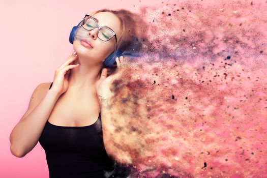 Conceptual image of woman listening to music while she is being dispersed in small particles from the feelings she gets from the music. Imagination and creativity. Conceptual music poster