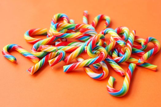 mini cherry candy canes on white background 