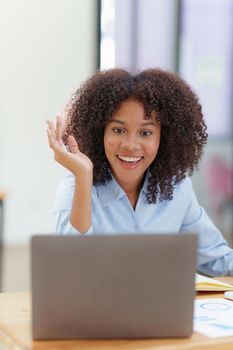 Attractive black businesswoman using laptop video conference call, business colleagues. Communicating with team.