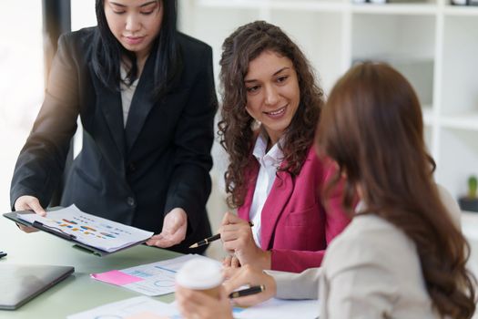 Business People Meeting to discuss and brainstorming the financial report paperwork in home office. Financial advisor teamwork and accounting concept.