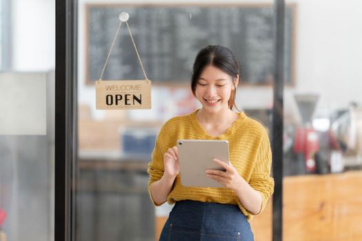 Portrait of Startup successful small business owner in coffee shop. SME entrepreneur seller business concept.