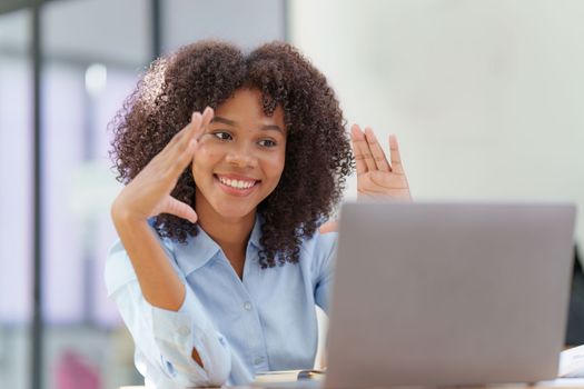 Attractive black businesswoman using laptop video conference call, business colleagues. Communicating with team.