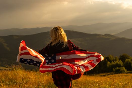 young beautiful woman holding USA flag