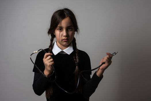 Wednesday student girl with a stethoscope.