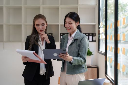 Group of business consultant working management big data and analyze financial document of company.