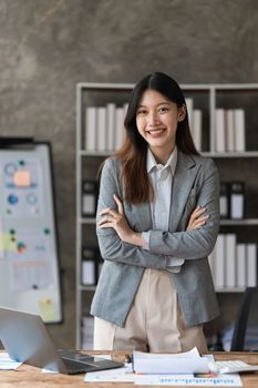 Smart asian business woman smiling at office space. real estate, lawyer, non-profit, marketing concept.