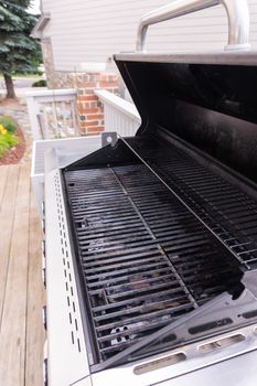 Clean six-burner gas grill ready for summer grilling.