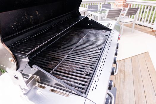 Clean six-burner gas grill ready for summer grilling.
