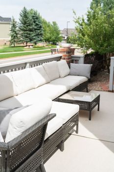 Patio of a luxury single-family home furnished with modern furniture.