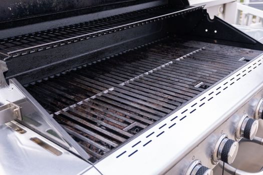 Clean six-burner gas grill ready for summer grilling.