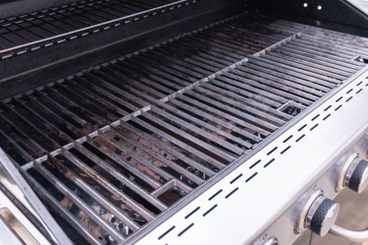 Clean six-burner gas grill ready for summer grilling.