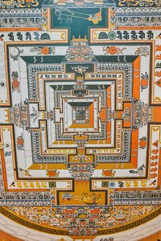 Image of Tibetan Mongolian Buddhist style artwork on ceiling inside of Chorten