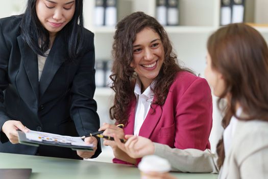 Business People Meeting to discuss and brainstorming the financial report paperwork in home office. Financial advisor teamwork and accounting concept.