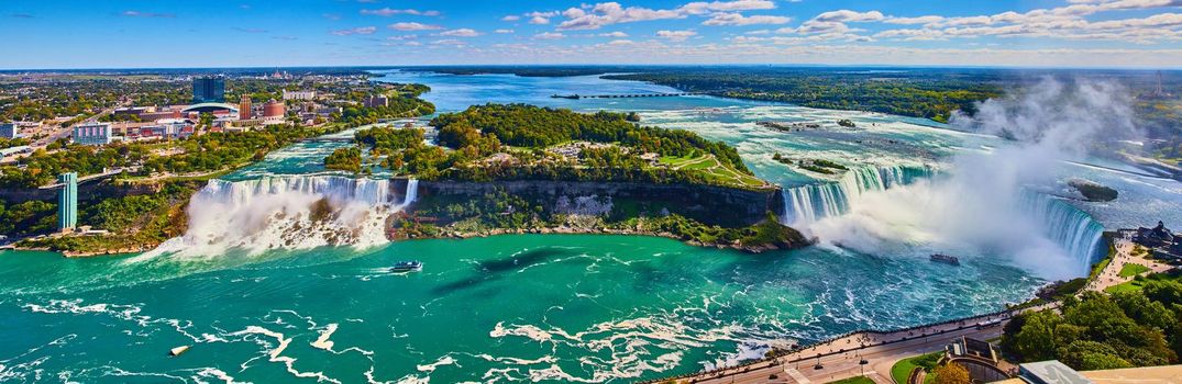Image of Wide panorama of entire Niagara Falls from Canada side overlook