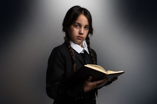 a girl in a black dress, Wednesday girl with a book.