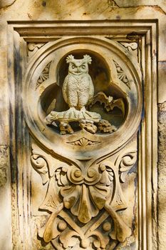 Image of Detail of owl and bat limestone sculpture in Central Park New York City
