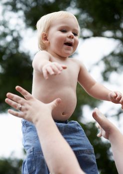 Fun with mommy. a baby boy playing with his mother