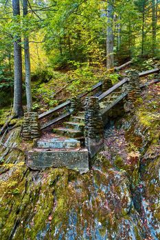 Image of Mossy cliff edge with stone steps leading to dangerous dead end