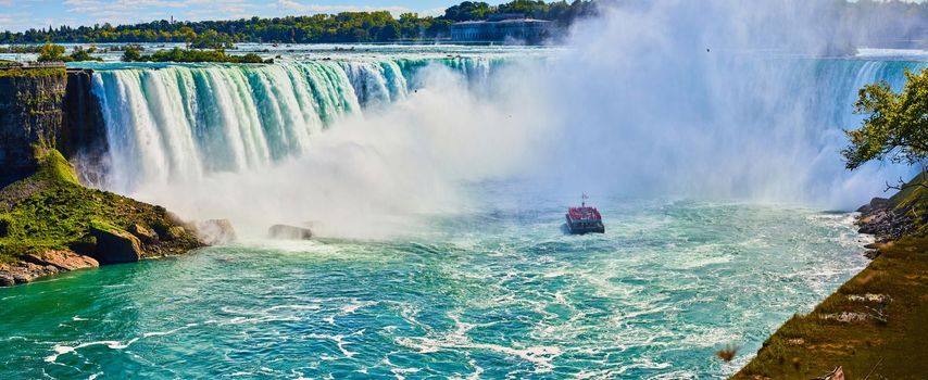 Image of Stunning Horseshoe Falls misting over tourist ship in Niagara Falls