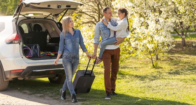 happy family enjoying road trip and summer vacation