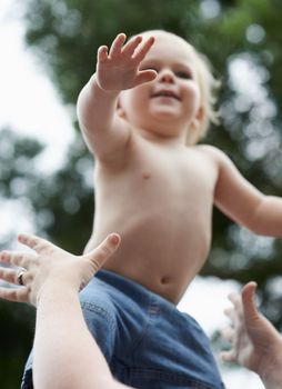 Fun with mommy. a baby boy playing with his mother