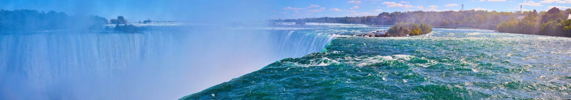 Image of Wide panoramic view of Horseshoe Falls up close on edge with misty falls in Niagara Falls